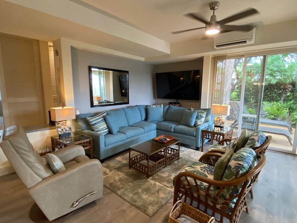 Enjoy the newly renovated living room with a 70 inch smart television.