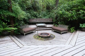 Large deck with sunken fire pit and lounge. 