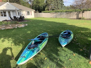 2 new kayaks and bikes to travel around in. Old house in background.