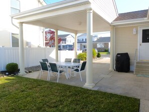 Outdoor covered eating Area with Weber Grill and lawn for the kids!