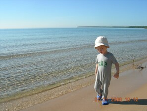 The sandy beach is a favorite for families with children.