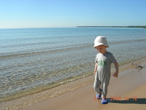 The sandy beach is a favorite for families with children.