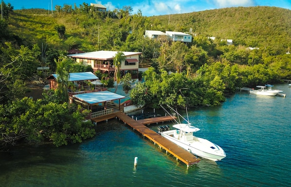 Main 2-level Villa with tl of 6/bdrm/3/bthrm, adjoining terraces, & private dock