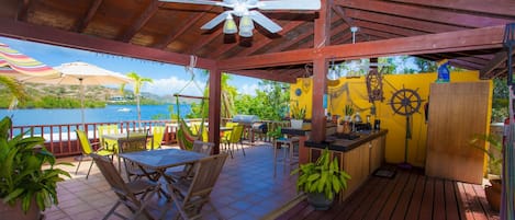 Adjoining outdoor kitchen terrace with bar, bbq & hammocks..above dock terrace..