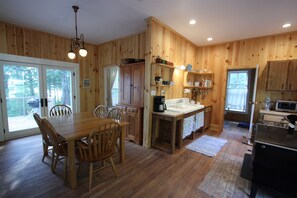 Open floor plan with kitchen, dining and living room.