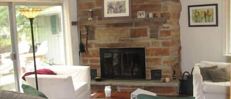 Fieldstone fireplace and comfortable seating in Great Room (also shows sofa bed)
