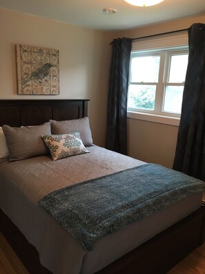 Bedroom on town side. Custom made Queen Bed, flat screen TV and ensuite