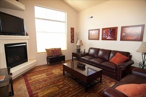 Plenty of Seating on the Leather Couches and Ottomans
