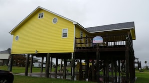 Large slab under the house for parking, grilling, playing games, or relaxing.