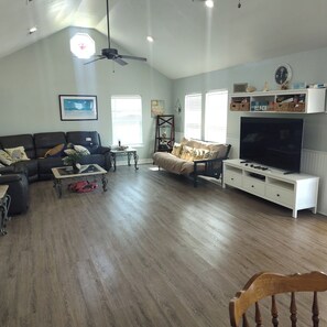 Living area updated with new sectional leather sofa.