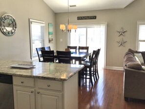 Open  kitchen with high top table seating for 8. And counter seating for 4. 