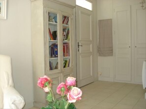 Bookcase beside front door to living room