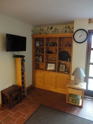 T.V. , DVD Player and shelving in den. Loads of DVD'S ,Music and board games.