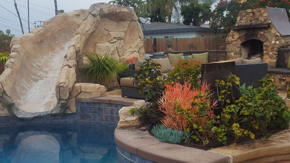 Enjoy the pool, slide, spa, bbq's, fireplace/firepit all in your own backyard!