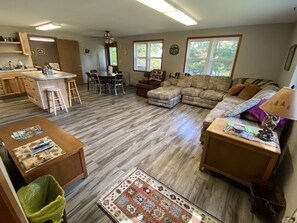 Cabin 4- Living Area and large dining table. Cabin has 3 exits.