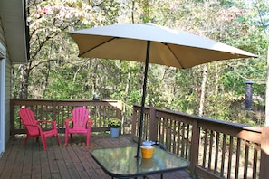 An attached deck allows for a beautiful viewing of the nature surrounding you. 