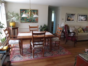 The main room has a comfortable dining table that will expand to accommodate 8.
