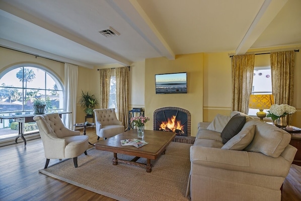 View sunshine and palm trees from the comfort of the living room.