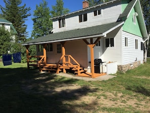 Gas/charcoal grill, back porch, back door entry