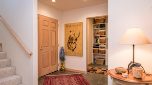 Entryway with laundry room and stairs leading to 
upstairs