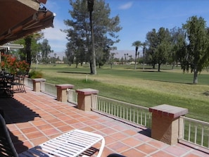 View from patio overlooking the 1st fairway. Driving range is in the background.