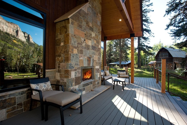 front deck of house: outdoor wood burning fireplace (sabrinabrantphotography.com