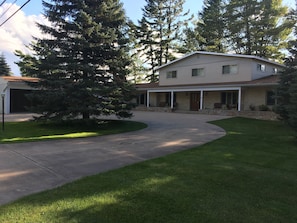 Street view of house with circular driveway.