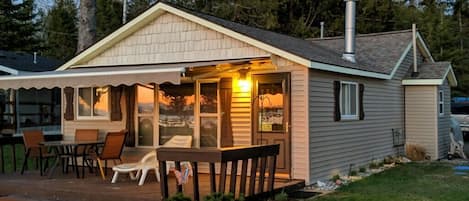 Enjoy a view of the lake from the welcoming deck with retractable awning!