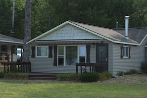 Enjoy a view of the lake from the welcoming deck with retractable awning!