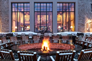 Fire Pit on Park Hyatt Patio with view of Antler Hall at base of slopes