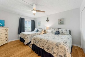 Bedroom with a queen and full bed, large closet and additional storage.