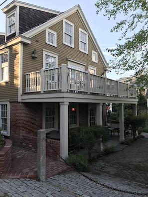 The covered porch and deck at the Adam Macool House