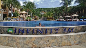 Huge 300 ft infinity pool with swim-up bar