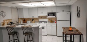 Kitchen with breathtaking Carrera marble designed countertops. 