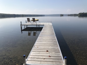 New Dock. 5’ deep at end of the dock and 12’ at the swim raft. 