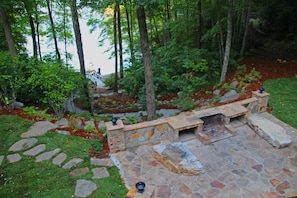 Photo taken from the entry level deck of the outdoor wood burning fire and dock
