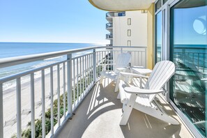 Large sunny oceanfront balcony with comfy chairs to relax for hours!