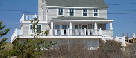 Front View of Home Showing Large Deck Area and covered porch