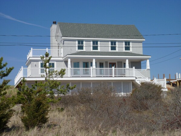 Front View of Home Showing Large Deck Area and covered porch