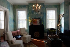 Sun filled living room with crystal chandelier