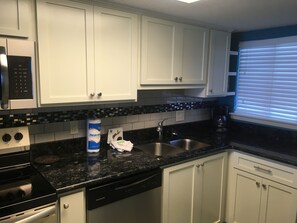 Custom cabinets, granite countertops, tile backsplash, renovated December 2017.