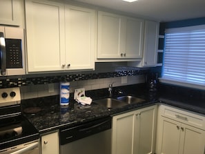 Custom cabinets, granite countertops, tile backsplash, renovated December 2017.