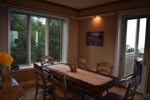 The dining room overlooks the great outdoors.