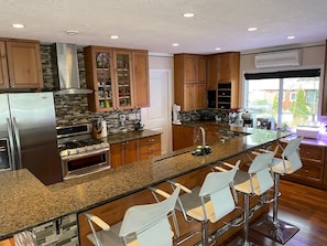 Kitchen with natural gas stove and stainless appliances