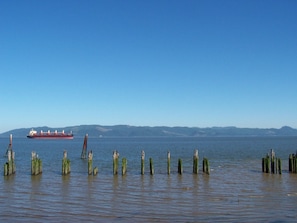 Ships traveling up river. view from sun porch.