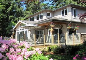 Front deck of glass panels that allow uninterrupted views and block breezes