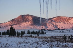 Icicles on the roof, sunset on Beehive Mountain.