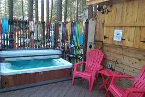 6 seat hot tub with surrounding ski fence for privacy and ambiance.