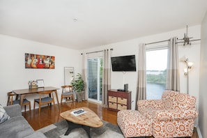 living room with queen size sleeper sofa and beautiful view of the river!