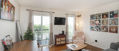 living room with queen size sleeper sofa and beautiful view of the river!